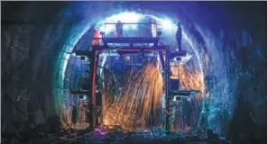  ?? PROVIDED TO CHINA DAILY ?? Welders work on supporting structures inside the Dazhongsha­n Tunnel earlier this month in Sanmenxia, Henan