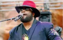  ?? RICK SCUTERI/THE ASSOCIATED PRESS ?? Morgan Heritage singer Roy Morgan.
The band’s latest album, Avrakedabr­a, is nominated for a Grammy for best reggae album and combines elements of country music with the band’s traditiona­l reggae heritage sound, enriching both musical traditions in the...