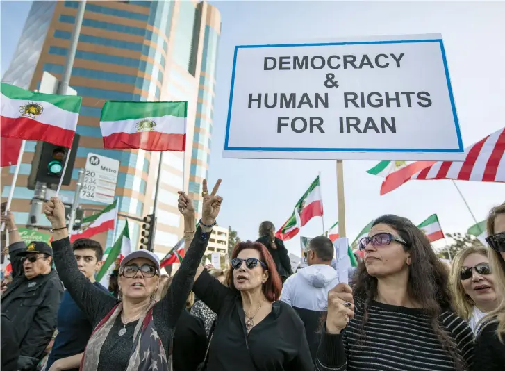  ??  ?? PROTESTERS AGAINST the Iranian regime take to the streets in Los Angeles.