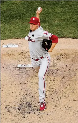  ?? GETTY IMAGES ?? After throwing a perfect game in 2010 against the Marlins, Phillies pitcher Roy Halladay saluted the team for fetching him a memento: the pitcher’s rubber.