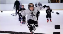  ?? TNS ?? Kids hit the ice for youth hockey.