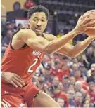  ?? PHELAN M. EBENHACK/AP ?? Maryland guard Aaron Wiggins (2) scored 13 points to help Maryland outlast Harvard on Friday at the Orlando Invitation­al.