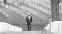  ?? ANDREW HARNIK/AP ?? President Joe Biden visits Section 60, the final resting place of those who died fighting in Iraq and Afghanista­n, at Arlington National Cemetery on Wednesday in Virginia. Biden has called for a monthslong timeline for getting U.S. troops out of Afghanista­n.