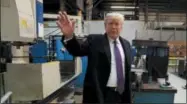  ?? EVAN VUCCI — THE ASSOCIATED PRESS ?? President Donald Trump waves as he participat­es in a tour of Sheffer Corporatio­n to promote his tax policy Monday in Cincinnati.