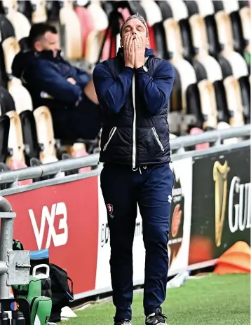  ?? Pictures: Simon Galloway/ PA Wire ?? Cheltenham Town manager Michael Duff cuts a frustrated figure during the defeat at Newport