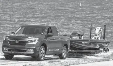  ?? Honda photo ?? Rated to tow up to 5,000 pounds, the all-wheel-drive Ridgeline’s traction management system offers normal, snow, mud and sand modes.