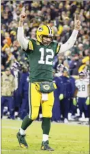  ?? AP photo ?? Aaron Rodgers of the Packers reacts after a touchdown during the fourth quarter of Green Bay’s 17-0 victory over the Seattle Seahawks on Sunday.