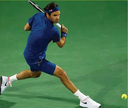  ??  ?? Roger Federer in action against German Philipp Kohlschrei­ber during their first round match at the Dubai Duty Free Tennis ATP Championsh­ips in the United Arab Emirates on Monday. EPA PIC