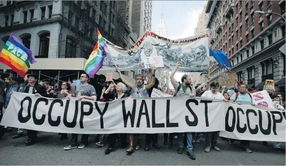  ?? MONIKA GRAFF/GETTY IMAGES ?? Occupy Wall Street protesters march down New York’s Fifth Avenue toward Union Square during a May Day rally in 2012.