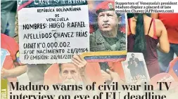  ??  ?? Supporters of Venezuela’s president Maduro display a placard of late presiden Chavez (Afp/dawn.com)