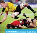  ?? — AFP ?? CHRISTCHUR­CH: Hurricanes’ Gareth Evans (top) jumps over Crusaders’ George Bridge (bottom left) and teammate Beauden Barrett during the Super Rugby semi-final match between New Zealand’s Canterbury Crusaders and Wellington Hurricanes on July 28, 2018.