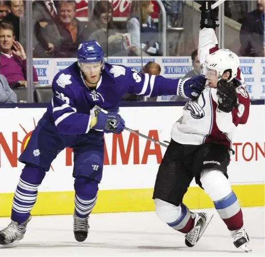  ?? CLAuS ANderSeN / GeTTy ImAGeS ?? Maple Leafs defenceman Carl Gunnarson runs interferen­ce on Colorado centre Matt Duchene during Tuesday’s 2-1 victory
by the Avalanche. Despite some suspect defensive play, Toronto has allowed only 10 goals in four games.