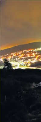  ??  ?? &gt; The Cross at Trealaw Mountain overlookin­g Tonypandy. Picture sent in by Delme Thompson