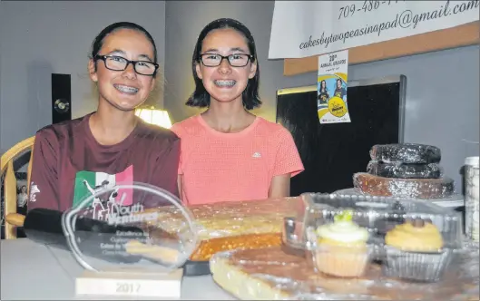  ?? KRYSTA CARROLL/THE ADVERTISER ?? At just 12 years old, twin sisters Cora and Devyn Hogg of Grand Falls-windsor operate an award-winning business, Cakes by Two Peas in a Pod.