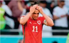  ?? AFP ?? Wales skipper Gareth Bale reacts at the end of the match against Iran, yesterday.