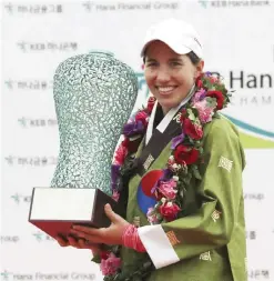  ?? — AP ?? INCHEON: Carlota Ciganda of Spain poses with her trophy after winning the LPGA KEB HanaBank Championsh­ip at Sky72 Golf Club in Incheon, South Korea, yesterday.