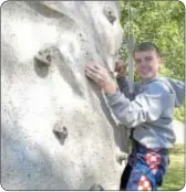  ??  ?? Michael Gigliotti had fun climbing the Extreme Rock Wall.