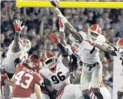  ?? GREGORY BULL/AP ?? Georgia’s Lorenzo Carter (7) blocks the second overtime field goal attempt by Oklahoma kicker Austin Seibert.