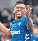  ??  ?? Alfredo Morelos celebrates after opening the scoring for Rangers.