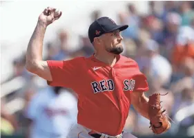  ?? JOHN BAZEMORE/AP ?? Red Sox starting pitcher Nathan Eovaldi throws against the Twins during a spring training game Feb. 24 in Fort Myers, Fla.