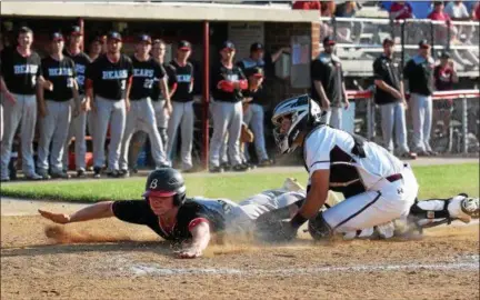  ?? AUSTIN HERTZOG - DIGITAL FIRST MEDIA ?? Boyertown’s Austyn Levengood dives to home plate and beats the tag of Conestoga’s Luke Czeipel to score a run during a District 1-6A quarterfin­al Friday.
