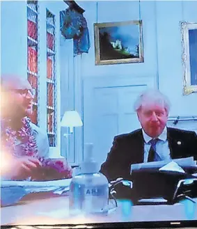  ?? ?? CALLING IN TO QUESTION Boris Johnson on the Downing Street quiz