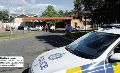  ??  ?? Daylight horror Police patrol the scene at St Leonards Square where a man was stabbed