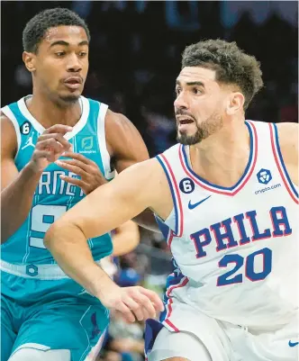  ?? RUSTY JONES/AP ?? Sixers forward Georges Niang moves around Hornets guard Theo Maledon during the second half on Wednesday.