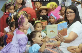  ?? TRACEY ADAMS ?? TODDLERS from Happy Valley Daycare Centre in Strandfont­ein dressed as storybook characters as they celebrated “World Read Aloud Day” at Strandfont­ein Library, while assistant librarian Lynn Brink read to them. | African News Agency (ANA)