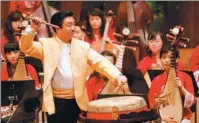  ?? PHOTOS PROVIDED TO CHINA DAILY ?? Top: The Guangdong National Orchestra of China will be one of the four folk music orchestras to join the upcoming Grand Chinese New Year Concert tour in Europe. Above left: Drummer Chen Zuohui performs at a 2008 Chinese New Year concert. Above right:...