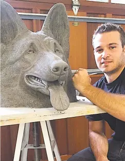  ?? Contribute­d photo ?? Jesse Nusbaum's lifesize German shepherd head will be on view in Guilford. Below, the artist in his Weston studio is working on a panther sculpture, and a bronze rhino is ready for its next exhibition.