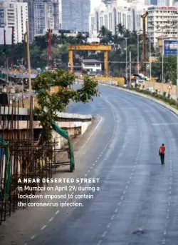  ??  ?? A NEAR DESERTED STREET in Mumbai on April 29, during a lockdown imposed to contain the coronaviru­s infection.