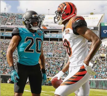  ?? LOGAN BOWLES / GETTY IMAGES ?? Jaguars cornerback Jalen Ramsey (20) was ejected from a game against the Bengals last season when he got into an altercatio­n on the field with former UGA receiver A.J. Green.