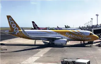  ?? The Yomiuri Shimbun ?? A Southeast Asian LCC plane is seen at an airport in Bali.