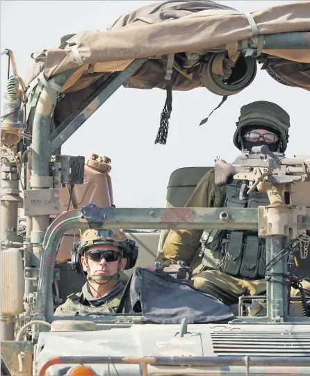  ?? Picture: REUTERS ?? Soldiers sit in a military vehicle near the Israel-Gaza border, February 28, 2024.