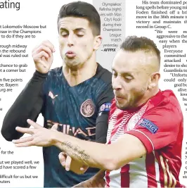  ?? – AFPPIX ?? Olympiakos’ Rafinha (right) vies with Man City’s Rodri during their Champions League match yesterday.