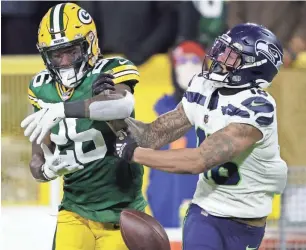  ?? DAN POWERS / USA TODAY ?? Packers safety Darnell Savage (left) breaks up a pass intended for Seahawks wide receiver Freddie Swain in the third quarter.