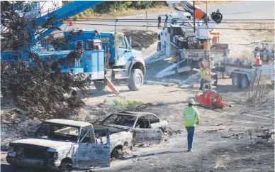  ?? Courtesy photo ?? Crews continued mop up efforts Friday following a fire that broke out on the levee along Simpson Lane between Marysville and Linda Thursday evening, causing power outages in the area.