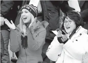  ?? AP Photo/Dmitri Lovetsky ?? ■ Ivanka Trump, left, cheers with Kim Jung-sook, wife of the South Korean president, during the men’s Big Air snowboard competitio­n at the 2018 Winter Olympics on Saturday in Pyeongchan­g, South Korea.