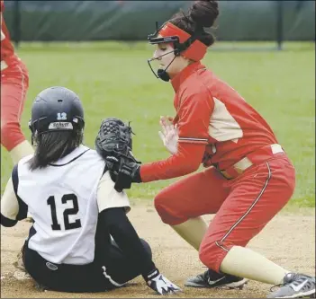  ?? Matt Freed/Post-Gazette ?? Gateway’s Danniele Taylor slides into second before the tag from Penn Hills’ Victoria DeVito Thursday. Gateway won the Class AAAA Section 2 softball game, 19-3.