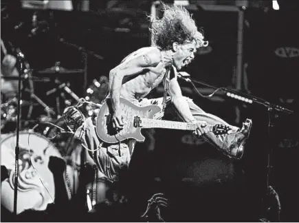  ?? JOHN MUNSON/AP ?? Eddie Van Halen performs in 2004 at Continenta­l Airlines Arena in East Rutherford, New Jersey.