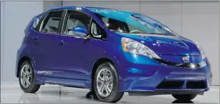  ?? REED SAXON/ AP ?? The 2013 Honda Fit EV is more efficient than its electric rivals from Ford, Nissan and Mitsubishi.