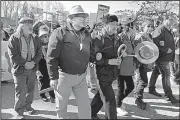  ?? AP/PHOUNG LEE ?? Protesters gather Saturday in Burnaby, British Columbia, for a rally against the proposed Trans Mountain pipeline expansion.