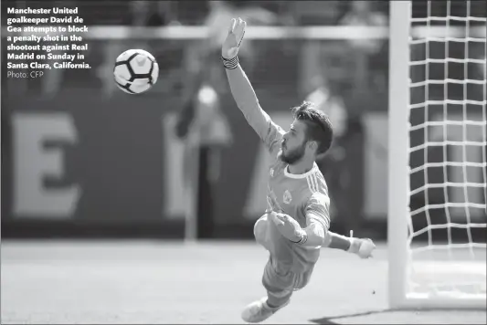  ??  ?? Manchester United goalkeeper David de Gea attempts to block a penalty shot in the shootout against Real Madrid on Sunday in Santa Clara, California.