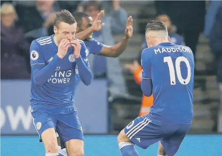  ??  ?? Leicester City’s Jamie Vardy (left) celebrates scoring his side’s second goal against Brighton last night.