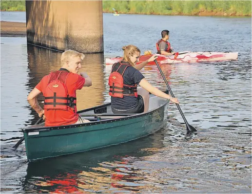  ??                                ?? Connor McCabe and Erica Theisen head out to lead one of the free canoe and kayak tours Middleton Recreation hosts from Riverside Park at 6:30 p.m. Thursday evenings.