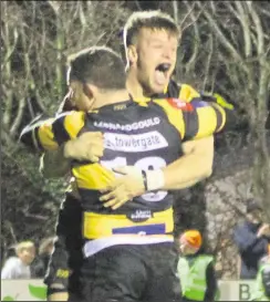  ??  ?? Sam Sterling celebrates his late try with Dan Smart