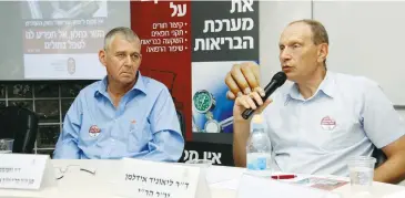  ?? (Courtesy IMA) ?? DR. LEONID EIDELMAN, chairman of the IMA, seated next to Dr. Nimrod Rahamimov, speaks at a press conference yesterday regarding the doctor’s strike.