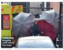  ??  ?? CONCERN Hospital staff shield the Duke