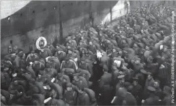  ??  ?? American troops on the dockside in Liverpool Oct. 22, 1918, prior to embarking for France